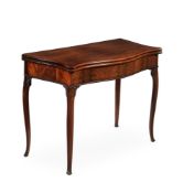 A GEORGE III MAHOGANY SERPENTINE FOLDING CARD TABLE, IN THE MANNER OF GEORGE HEPPLEWHITE