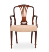 A GEORGE III MAHOGANY ARMCHAIR, AFTER A DESIGN BY GEORGE HEPPLEWHITE