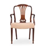 A GEORGE III MAHOGANY ARMCHAIR, AFTER A DESIGN BY GEORGE HEPPLEWHITE