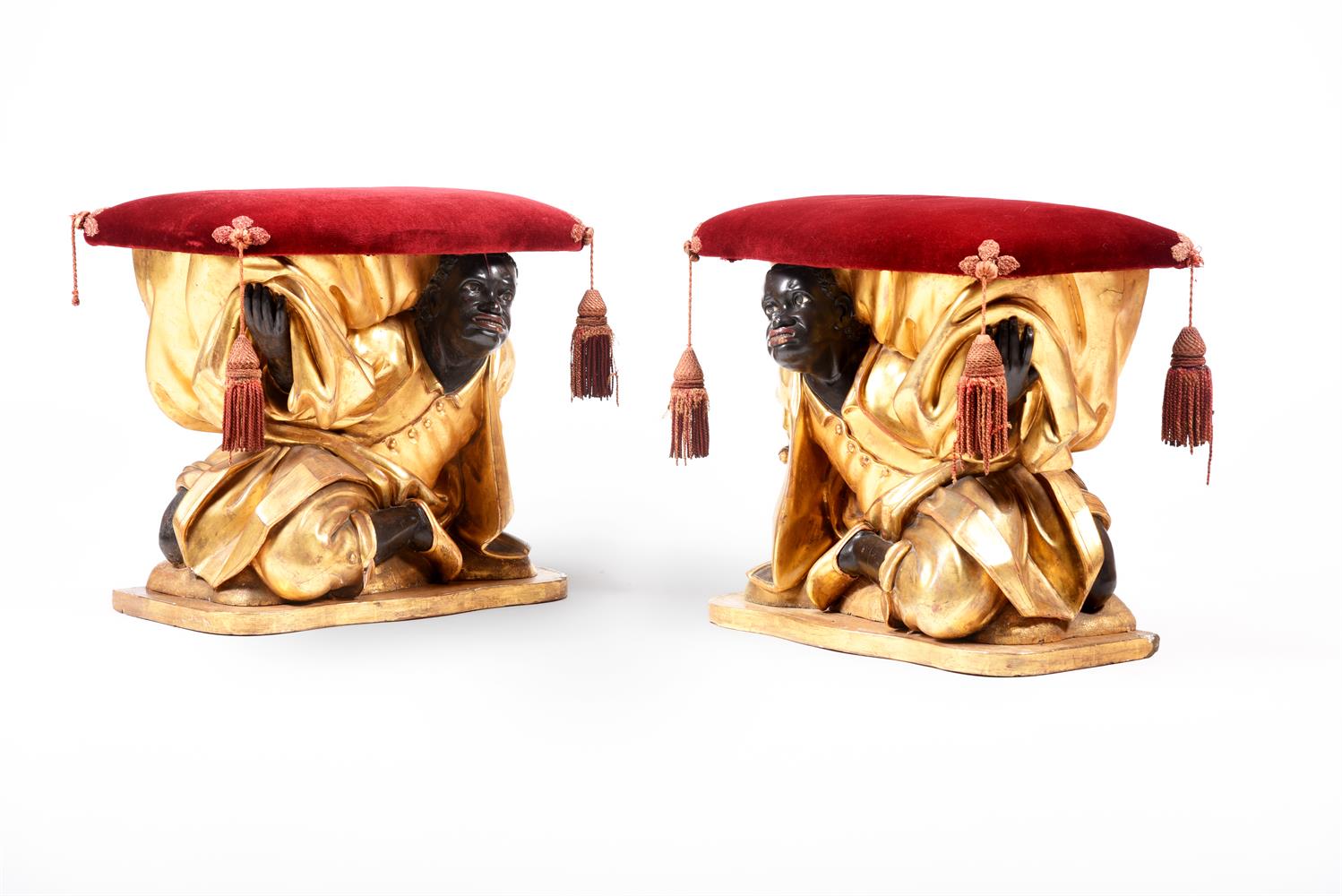 Y A PAIR OF ITALIAN GILTWOOD AND EBONISED 'BLACKAMOOR' STOOLS, 19TH CENTURY