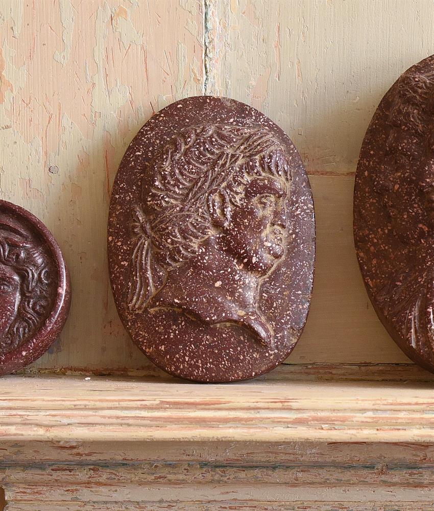 A CARVED RED PORPHRITIC STONE CAMEO, IN THE ITALIAN GRAND TOUR MANNER