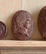 A CARVED RED PORPHRITIC STONE CAMEO, IN THE ITALIAN GRAND TOUR MANNER