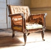 A REGENCY SIMULATED ROSEWOOD AND PARCEL GILT LIBRARY ARMCHAIR, CIRCA 1815