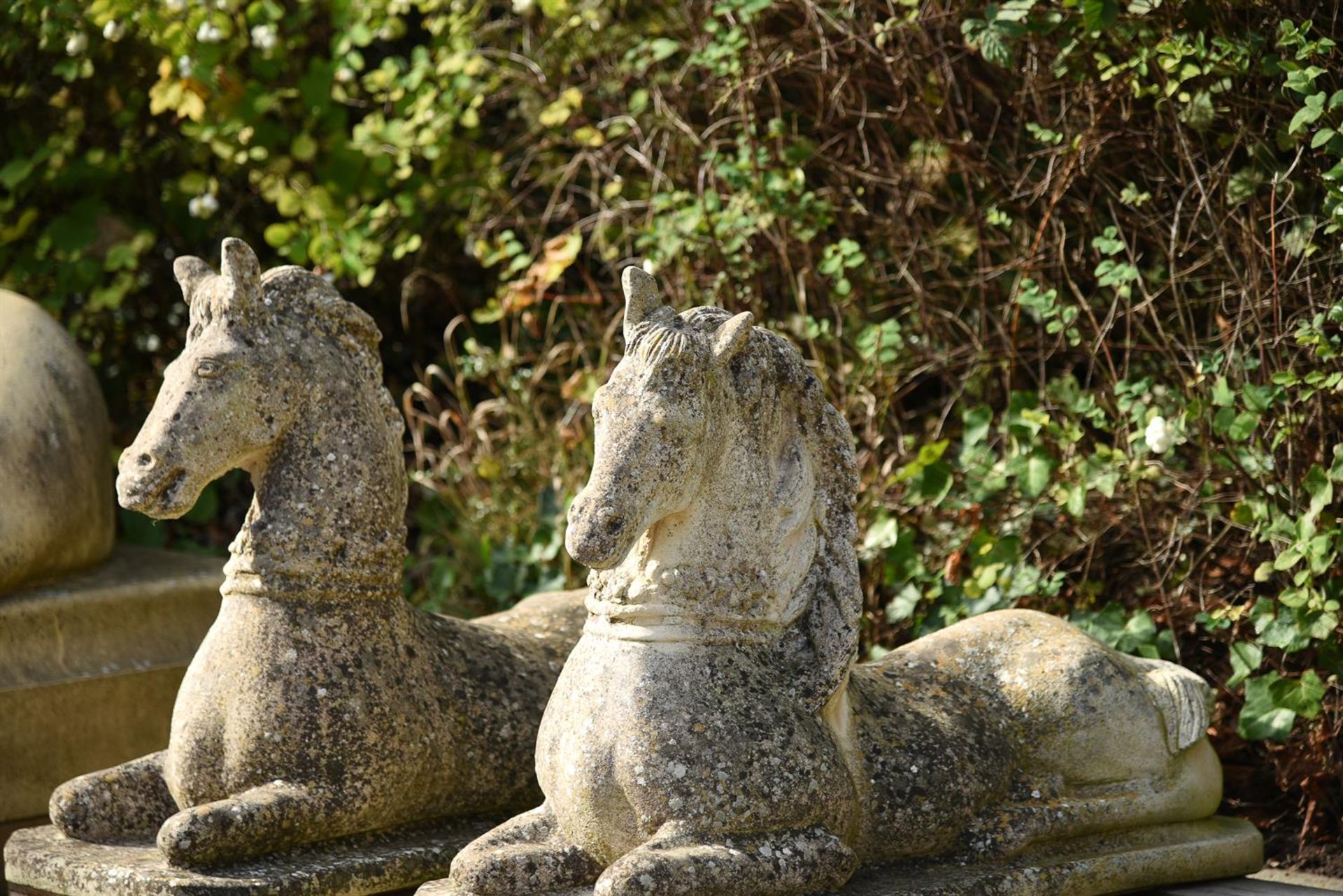 A PAIR OF COMPOSITION STONE RECUMBENT HORSES, 20TH CENTURY - Image 2 of 3