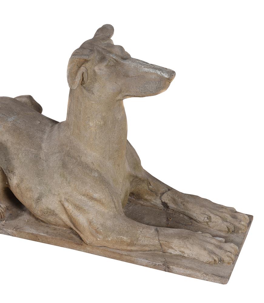 A PAIR OF CARVED STONE MODELS OF RECUMBENT HOUNDS, 19TH CENTURY - Image 2 of 7