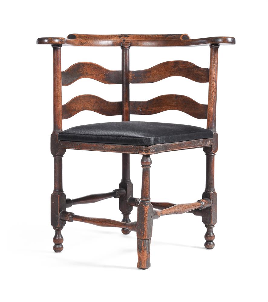 A GEORGE II WALNUT CORNER ARMCHAIR, MID 18TH CENTURY