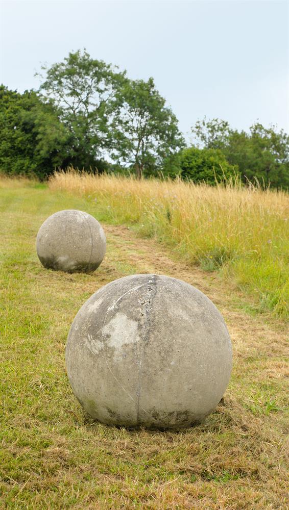 A LARGE PAIR OF STONE COMPOSITION BALLS, 20TH CENTURY