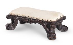 A SMALL CARVED BEECH STOOL, IN THE MANNER OF WILLIAM KENT, 18TH OR EARLY 19TH CENTURY