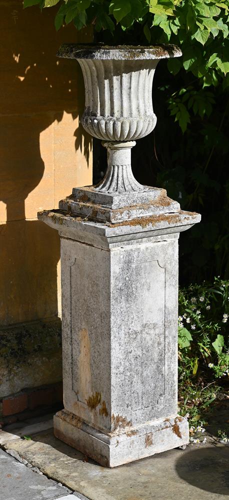 A PAIR OF COMPOSITION STONE CAMPANA URNS ON PLINTHS, LATE 19TH/EARLY 20TH CENTURY - Image 3 of 3