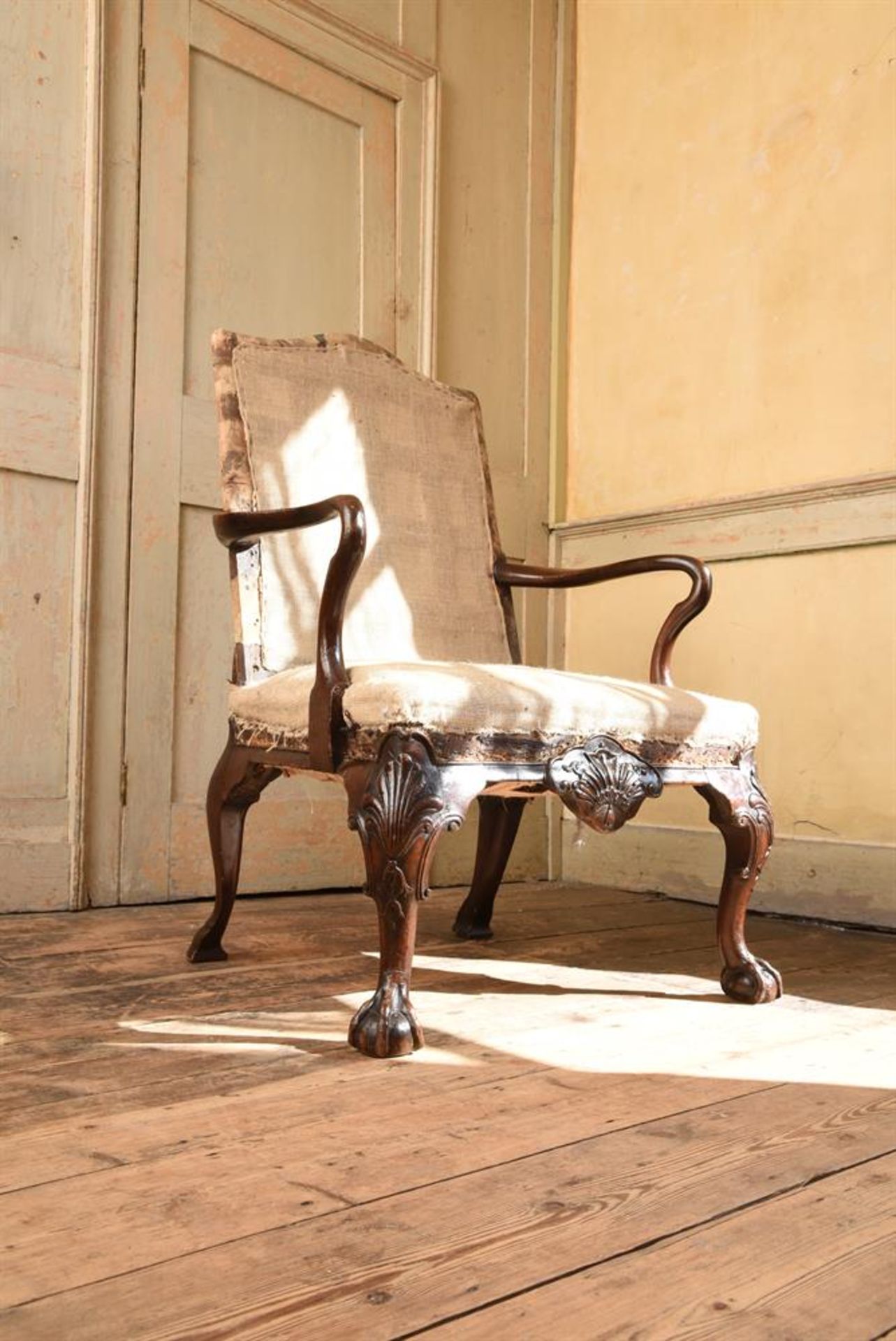 A GEORGE II CARVED WALNUT OPEN ARMCHAIR, ATTRIBUTED TO JAMES MOORE, CIRCA 1730