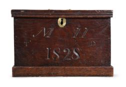 A CARVED OAK BOX, DATED 1828 BUT POSSIBLY EARLIER