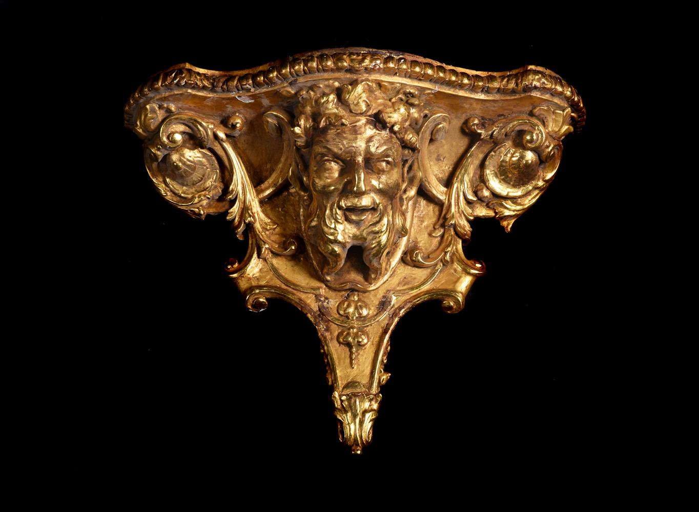 A LARGE GEORGE II CARVED GILTWOOD BACCHUS HEAD WALL BRACKET, CIRCA 1750