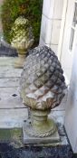 A PAIR OF COMPOSITION STONE 'HAM HOUSE PINEAPPLE' FINIALS, PROBABLY BY HADDONSTONE, 20TH CENTURY
