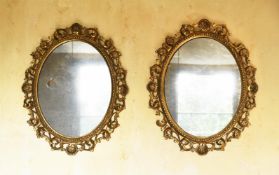 A PAIR OF ITALIAN CARVED GILTWOOD OVALL MIRRORS, FLORENTINE, LATE 18TH CENTURY