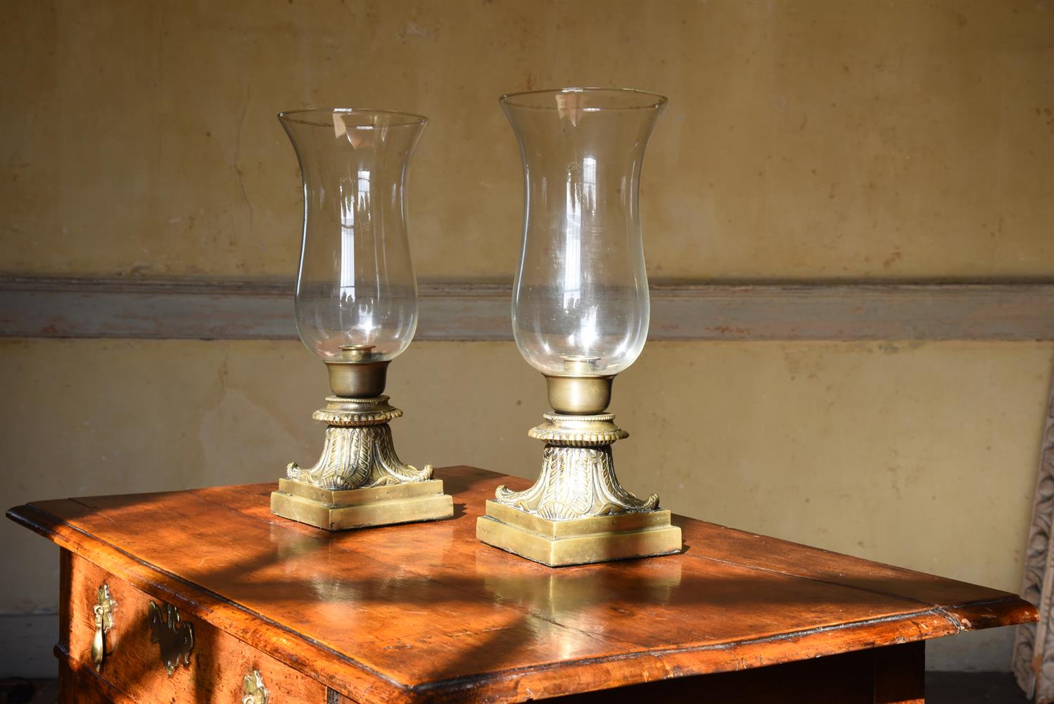 A PAIR OF BRONZE TABLE TOP STORM LANTERNS, LATE 19TH CENTURY/EARLY 20TH CENTURY