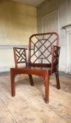A GEORGE III MAHOGANY 'COCKPEN' ARMCHAIR, IN THE MANNER OF THOMAS CHIPPENDALE, CIRCA 1790
