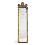 A GEORGE II CARVED GILTWOOD MIRROR, IN THE MANNER OF JOHN BELCHIER, CIRCA 1730