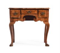 A GEORGE I FIGURED WALNUT AND FEATHER BANDED SIDE TABLE, CIRCA 1720