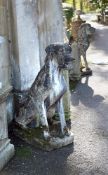 A LARGE PAIR OF COMPOSITION STONE SEATED HOUNDS, 20TH CENTURY