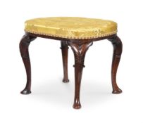 A GEORGE I WALNUT AND UPHOLSTERED STOOL, CIRCA 1715