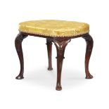 A GEORGE I WALNUT AND UPHOLSTERED STOOL, CIRCA 1715