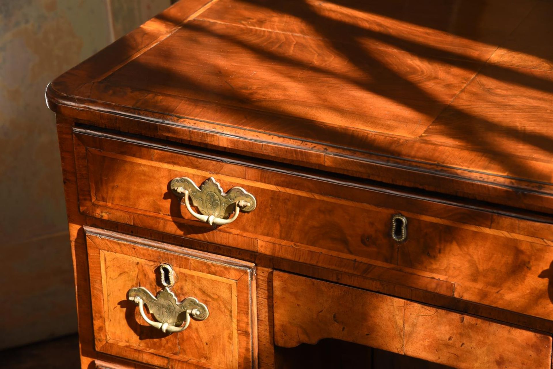 A GEORGE II WALNUT AND CROSSBANDED KNEEHOLE DESK, CIRCA 1730 - Image 4 of 4