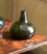 AN 'ONION' SHAPED OLIVE-GREEN TINT SEALED WINE BOTTLE, ENGLISH, EARLY 18TH CENTURY