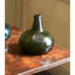 AN 'ONION' SHAPED OLIVE-GREEN TINT SEALED WINE BOTTLE, ENGLISH, EARLY 18TH CENTURY