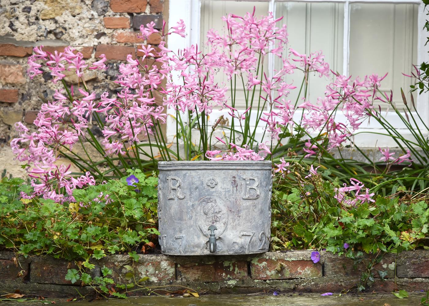 A GEORGE III LEAD CISTERN, DATED 1772