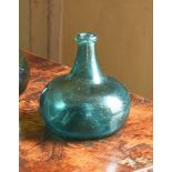 AN UNUSUAL PALE-GREEN TINT 'ONION' WINE BOTTLE, EARLY 18TH CENTURY