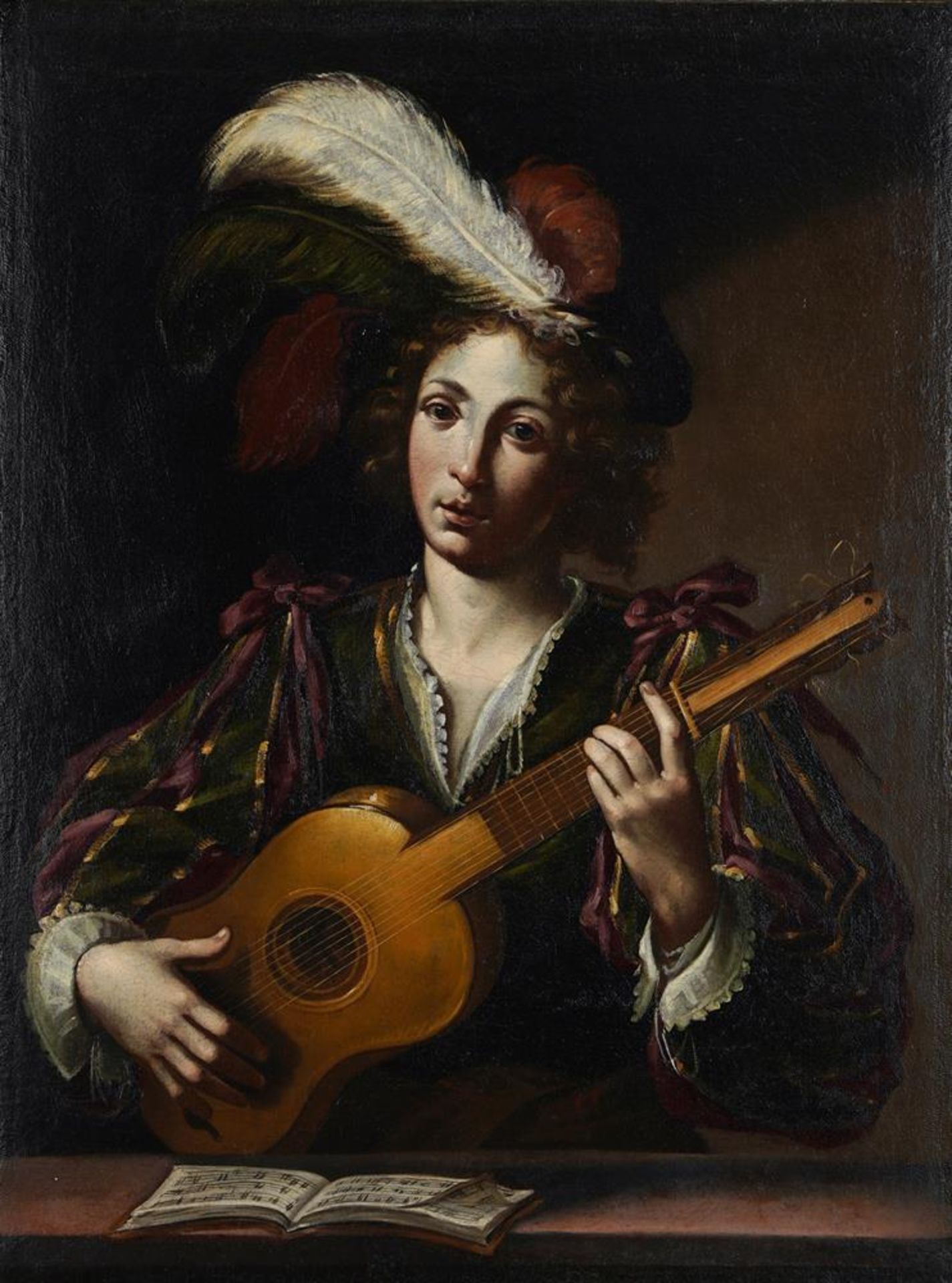 CIRCLE OF CLAUDE VIGNON (FRENCH 1593-1670), A YOUNG MAN PLAYING THE GUITAR