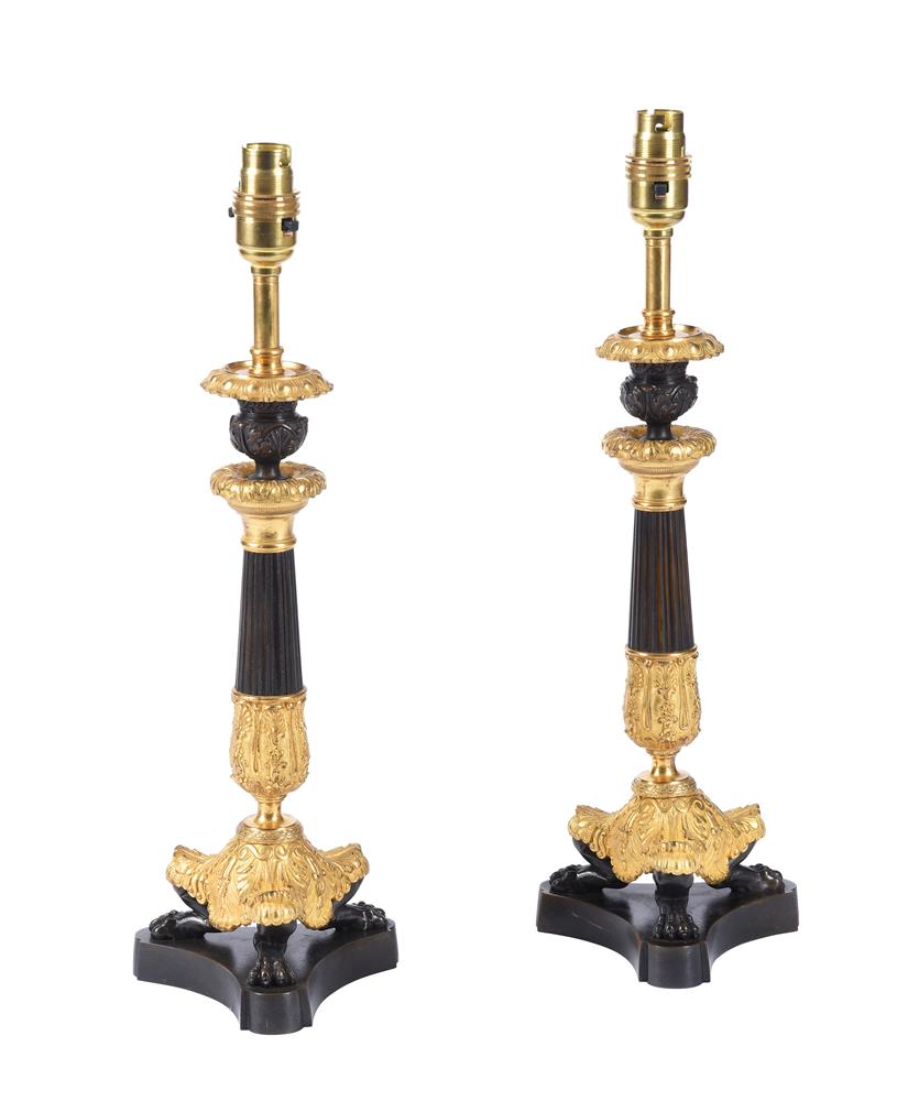 A PAIR OF GILT AND PATINATED METAL TABLE LAMPS