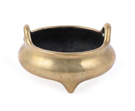 A CHINESE BRONZE TWIN-HANDLED TRIPOD CENSER