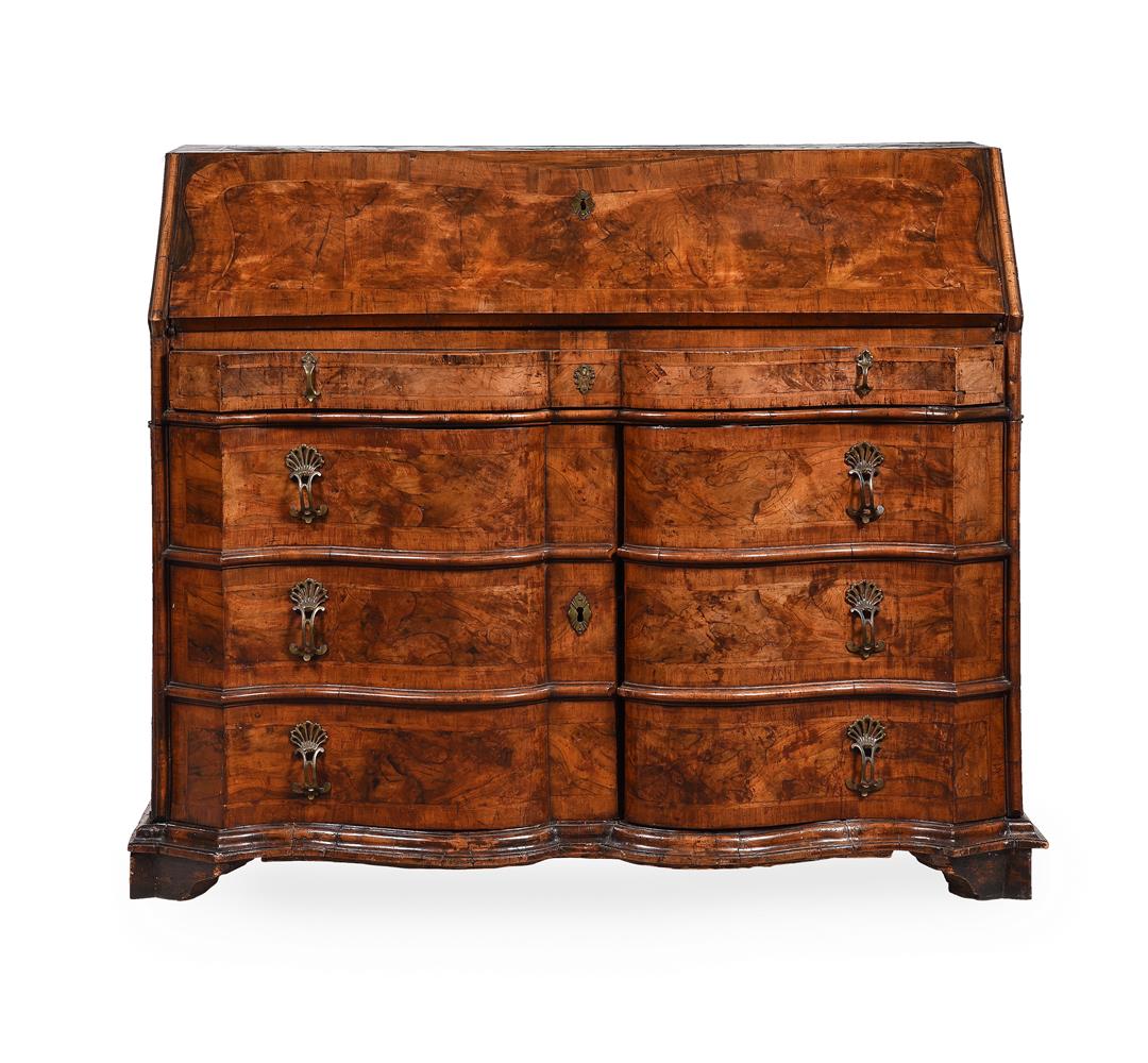 A WALNUT SERPENTINE FRONTED BUREAU, PROBABLY SOUTH GERMAN