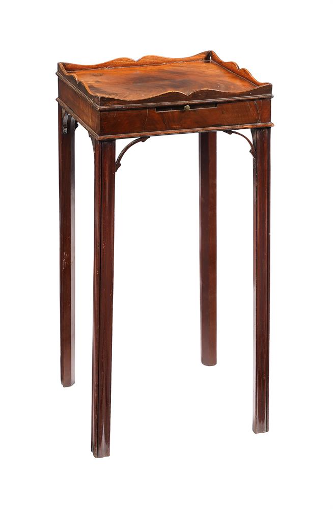 A MAHOGANY URN STAND