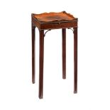 A MAHOGANY URN STAND