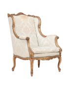 A GILTWOOD ARMCHAIR IN LOUIS XV STYLE