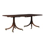 A MAHOGANY DINING TABLE IN GEORGE III STYLE
