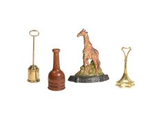 A GROUP OF FOUR VARIOUS DOOR STOP AND PORTERS