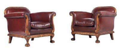 A PAIR OF WALNUT AND LEATHER UPHOLSTERED BERGERE ARMCHAIRS