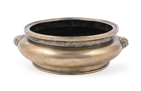 A CHINESE BRONZE TWIN-HANDLED CENSER