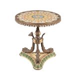 A CONTINENTAL PORCELAIN, POTTERY, AND GILT METAL MOUNTED GUERIDON TABLE IN FRENCH EMPIRE STYLE