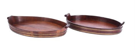 TWO SIMILAR MAHOGANY AND BRASS BOUND OVAL TRAYS