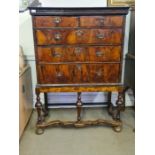 Late 17th century figured walnut chest with feather crossbandings, polished pine sides on later base