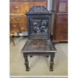 Victorian dark oak carved hall chair, back carving depicting Shakespeare "Merchant of Venice" Act