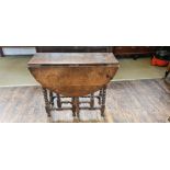 Georgian oak bobbin turned single leaf drop leaf table.