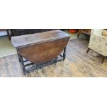 18th century oak gate leg table with turned legs with single drawer.