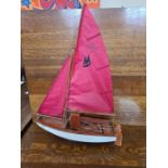 Hand built radio controlled sailing dinghy 22" long.
