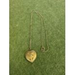 A 417 10ct white gold chain and heart pendant 7.5g.