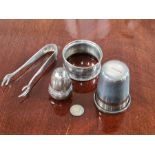 Small items of silver, oversized thimble, sugar tongs, napkin ring and pepper pot, 60g.